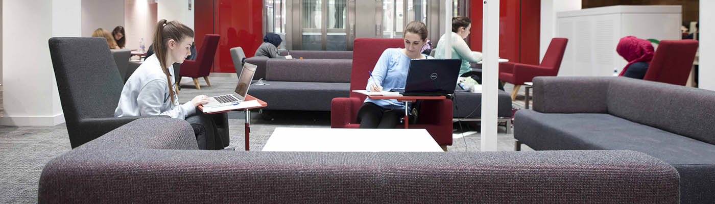 Students using laptops in the Alan Gilbert Learning Commons.